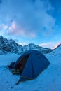 Blue tent in the base camp in the mountains