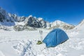 Blue tent in the base camp in the mountains