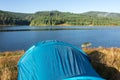 Blue tent on the lake side, early morning Royalty Free Stock Photo