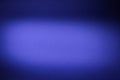 On the blue textural blurry background light purple cloud of light
