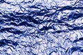 Blue texture of crumpled sheet of aluminum foil. Foil background. Royalty Free Stock Photo