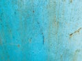 Blue texture, metal wall painted in blue paint. the background. peeling, old paint on the metal, traces of corrosion and damage. Royalty Free Stock Photo