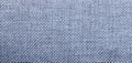 Blue textured fabric close-up shot, ideal for backgrounds, design, or textile applications. The weave pattern adds depth Royalty Free Stock Photo