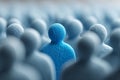 Blue textured figure differentiating from a uniform crowd of people Royalty Free Stock Photo