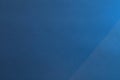 Blue Textured Paper with Diagonal Light Shadow. Royalty Free Stock Photo