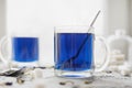 Blue Thai Anchan tea in a glass mug