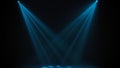 Blue theatrical beams of overhead light illuminating an empty dark stage. Bright neon spotlights and smoke on a black Royalty Free Stock Photo