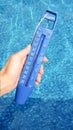 Blue thermometer in the pool