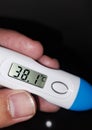 blue thermometer tool high heat sick child 38 degrees Celsius