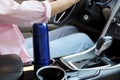 Blue thermos in holder inside of car Royalty Free Stock Photo