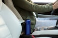 Blue thermos in holder inside of car Royalty Free Stock Photo