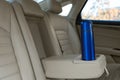 Blue thermos in holder inside of car Royalty Free Stock Photo