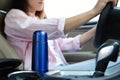 Blue thermos in holder inside of car Royalty Free Stock Photo