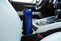 Blue thermos in holder inside of car Royalty Free Stock Photo