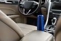 Blue thermos in holder inside of car Royalty Free Stock Photo