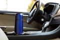 Blue thermos in holder inside of car Royalty Free Stock Photo