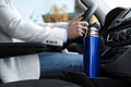 Blue thermos in holder inside of car Royalty Free Stock Photo