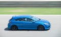 Blue third generation Opel Astra OPC running on the race track Royalty Free Stock Photo