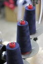 Blue thread on red bobbins