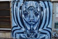 Blue three eyed face Graffiti on a wall in Florentin Tel Aviv Israel