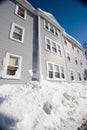 Blue three story house in winter