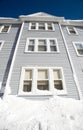 Blue three story house in winter