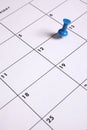 Blue Thumb Tack on Calendar Royalty Free Stock Photo