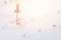 Blue thumbtack on calendar with pink marker circle in word payday for remind Royalty Free Stock Photo