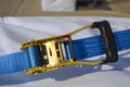 Blue tie down strap ratchet Royalty Free Stock Photo