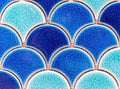 Blue tile mosaic in the form of scales. Tile texture with a marine design Royalty Free Stock Photo