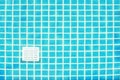 Blue tile square mosaic and drainage at the pool floor. Background and texture of blue tile square mosaic. Take photo through Royalty Free Stock Photo