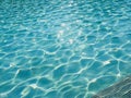 Blue tiled pool background summer Royalty Free Stock Photo