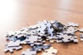 blue tiles of a puzzle on a wooden table. Concept to indicate le