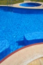 Blue tiles swimming pool water texture Royalty Free Stock Photo