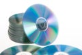 Blue tinted close-up of a stack of cd-roms CD lying on white table Royalty Free Stock Photo