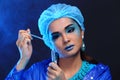 Blue Tone Fashion Scientist in Dark room laboratory with tools l