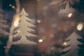 Blue toned blurred chrismas background with Christmas trees and street lights in vintage style Royalty Free Stock Photo