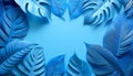 Blue-toned tropical leaves arranged in a circular pattern on a light background, showcasing intricate details and textures Royalty Free Stock Photo