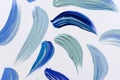 Blue tones paint strokes on white.Abstract background.