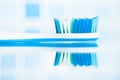 Blue toothbrush in a bathroom Royalty Free Stock Photo