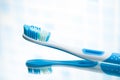 Blue toothbrush mirror reflection Royalty Free Stock Photo