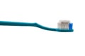 Blue toothbrush with toothpaste isolated on white background Royalty Free Stock Photo