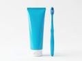 Blue toothpaste tube and toothbrush isolated on white background Royalty Free Stock Photo