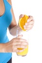 Blue top squeezing orange juice Royalty Free Stock Photo