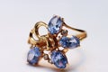 Blue topaz on golden rings Royalty Free Stock Photo