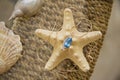 blue topaz over seastar at table Royalty Free Stock Photo
