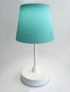 Blue Touch Table Lamp turned on with warm light isolated on white background. Interior lighting and home decoration design object Royalty Free Stock Photo