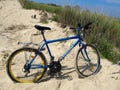 Blue tourist bike on the sand