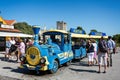 Blue tourist mini train and bus in Visby, Gotland, Sweden