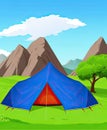 Blue tourist tent on a green meadow, against the backdrop of mountains